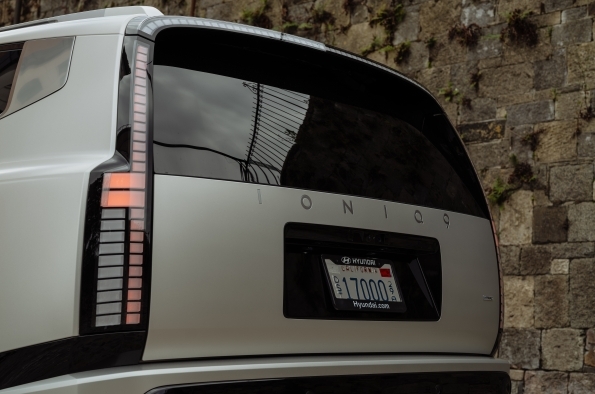 The rear of a Hyundai IONIQ 9, showing the pixel taillight and the IONIQ lettering on the tailgate